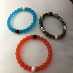 3 Lokai Bracelets (camo, red, and blue)